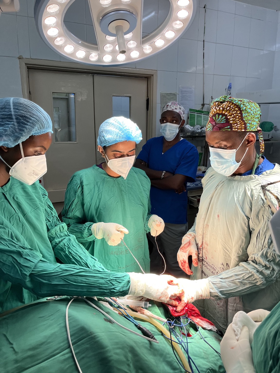 Neysa Sanghavi working with a surgical team in an operating room